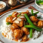 Elevate Your Meals with Chinese Almond Chicken Magic 15 Crispy Chinese almond chicken with almond sauce and rice.